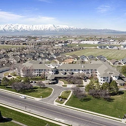 Pioneer Valley Lodge Gracious Retirement Living Hawthorn Senior Independent Living in North Logan, Utah front exterior drone view
