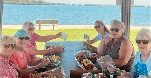 Hidden Lakes Senior Living Community Vero Beach, FL, residents enjoy a picnic outdoors
