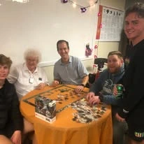 Pioneer Valley Lodge Gracious Retirement Living Hawthorn Senior Independent Living in North Logan, Utah residents solving a puzzle