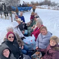 Pioneer Valley Lodge Gracious Retirement Living Hawthorn Senior Independent Living in North Logan, Utah residents outside in the winter